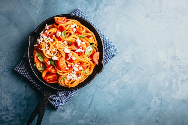 Italian pasta with tomato sauce in pan