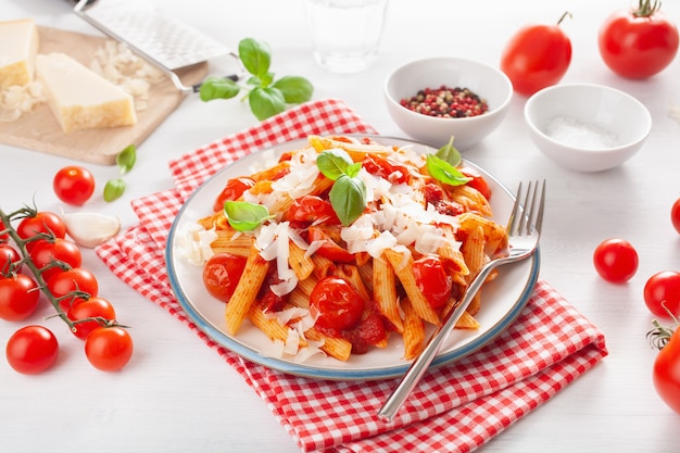 Italian penne pasta with tomatoes parmesan basil