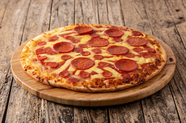 Italian pepperoni pizza on wooden table