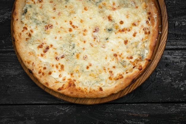 Italian pizza on a dark table