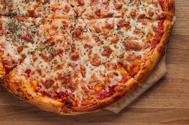 Italian pizza Margherita on wooden background