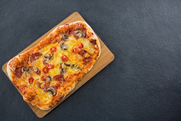 Italian pizza served on a chopping board