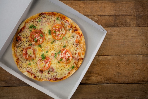 Italian pizza served in a opened box