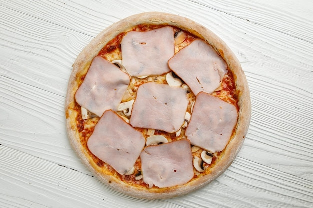 Italian pizza on a white wooden table