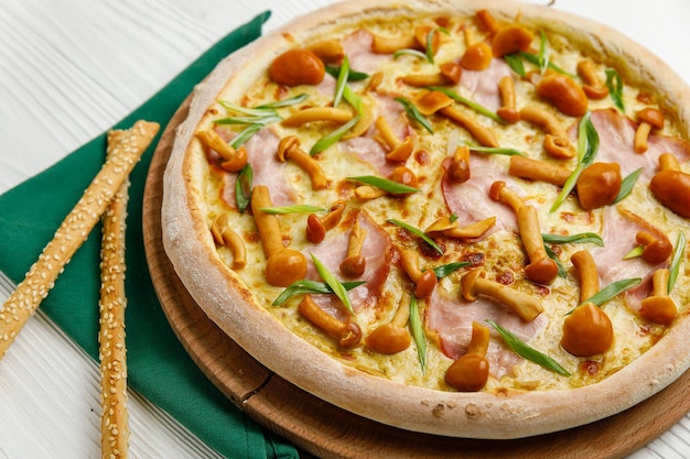 Italian pizza on a white wooden table