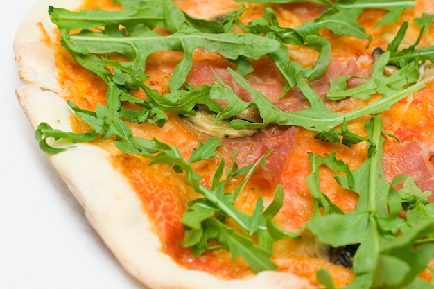 Italian pizza with arugula - closeup