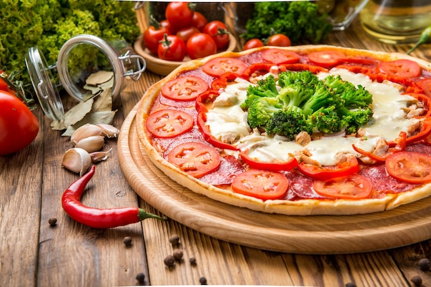 Italian pizza with cheese on a wooden table