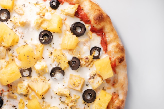 Italian pizza with pineapple and olives The process of making pizza Street food cooking concept