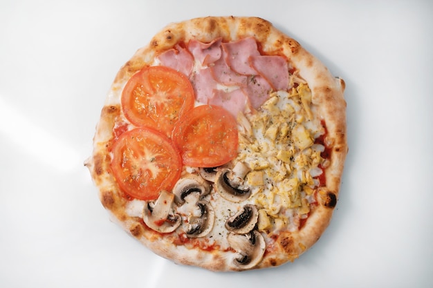 Italian pizza with salami and mushrooms and ham 4 seasons