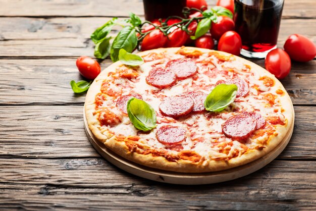 Italian pizza with tomato and salami