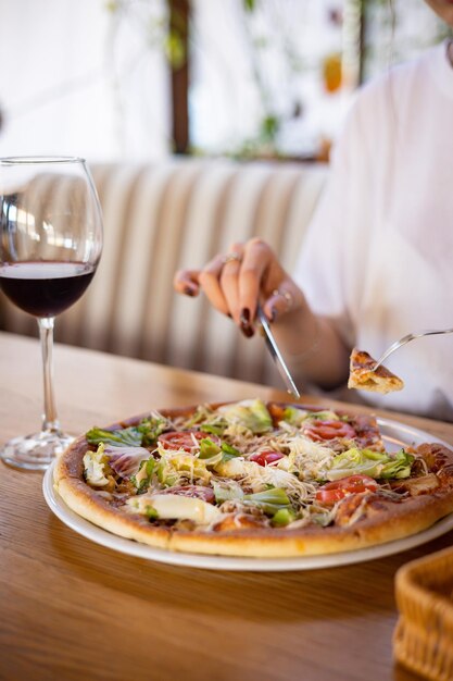 Italian pizza on a wooden table in a restaurant