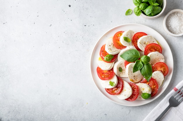 Italian salad Caprese in a white plate