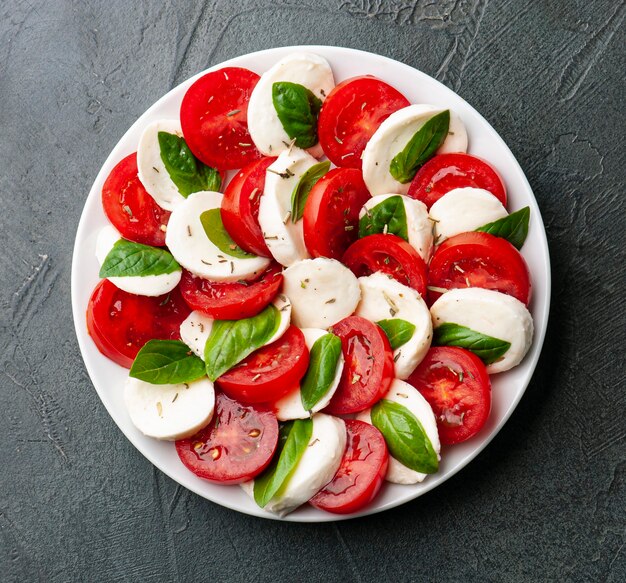 Italian  salad. Mozzarella chesseand tomatoes with basil  leaves. Caprese salad.