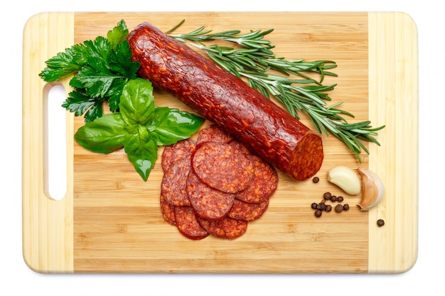 Italian Salami or spanish chorizo on wooden cutting board