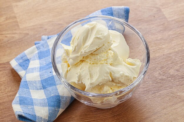 Italian soft dairy mascarpone cheese in the bowl