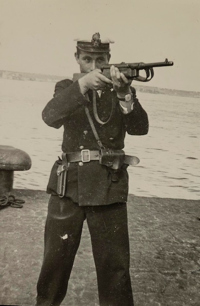 Italian soldier aiming rifle in the 50s