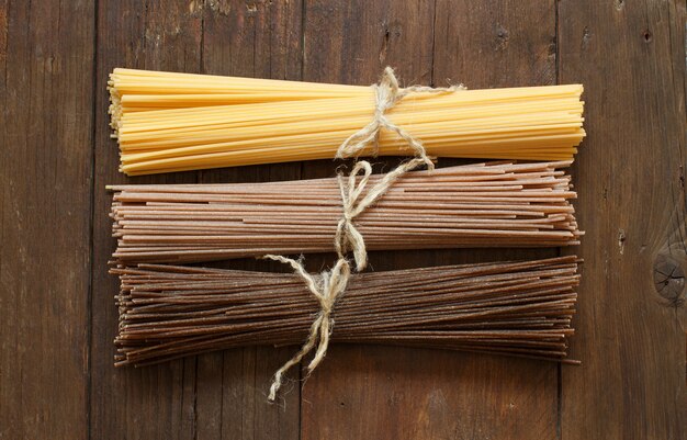 Italian spaghetti on the old wooden table top view