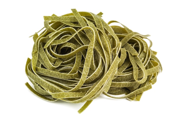 Italian spinach fettuccine on white background