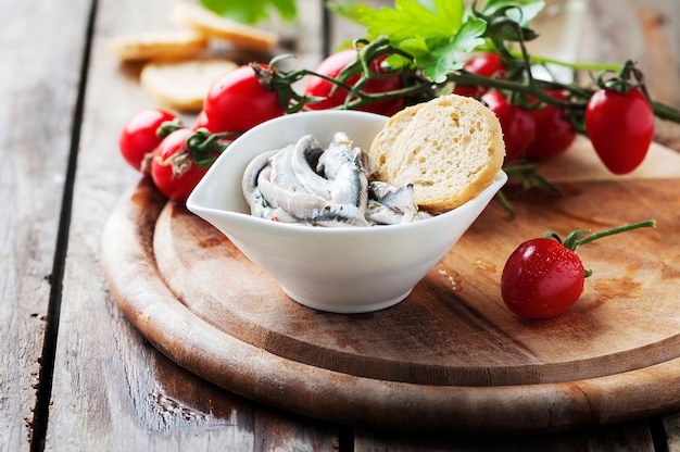 Italian traditional anchovy with bread and tomato