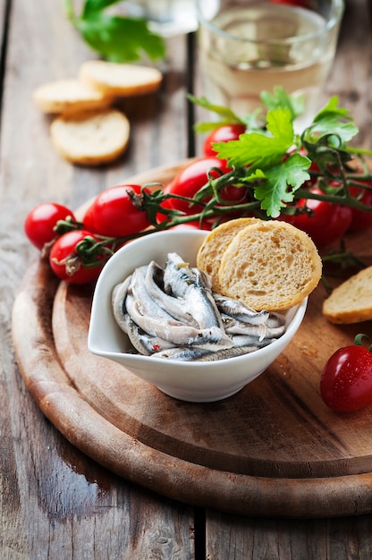 Italian traditional anchovy with bread and tomato