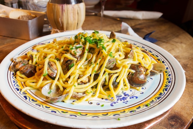 Italisn pasta with clams on big plate