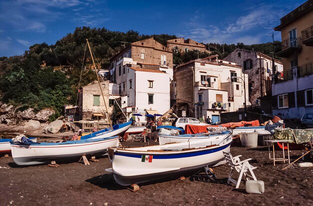 Italy Campania Cala di Puolo Sorrento wooden fishing boats ashore on the beach FILM SCAN