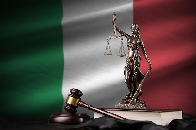 Italy flag with statue of lady justice constitution and judge hammer on black drapery Concept of judgement and guilt