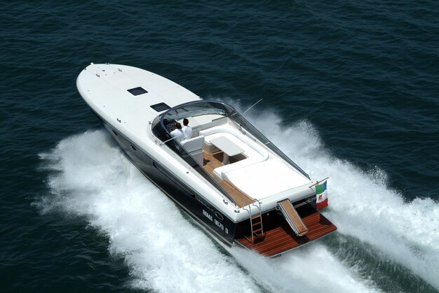 Photo italy, meditarranean sea, fiumicino (rome); 12 july 2003, aerial view of people on a luxury yacht - editorial