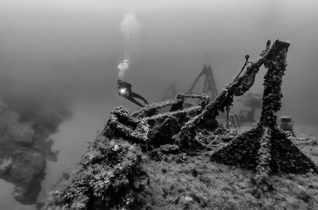 Italy, Mediterranean Sea, diver and a sunken ship wreck - FILM SCAN