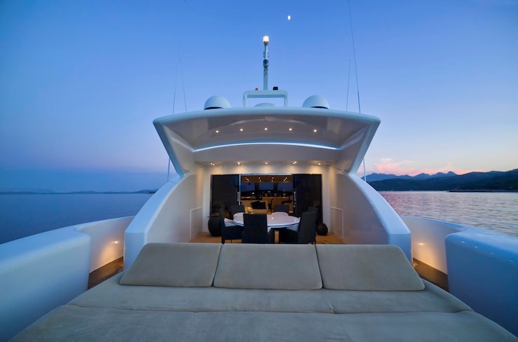 Photo italy, sardinia, tyrrhenian sea, 35 meters luxury yacht, poop deck at sunset