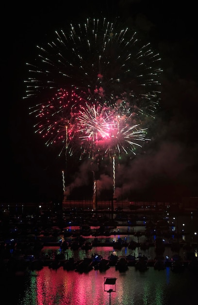 Italy, Sicily, Marina di Ragusa, fireworks on the marina