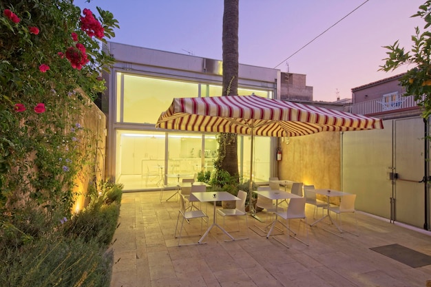 Italy, Sicily, Marina di Ragusa (Ragusa Province) 13 July 2011; hotel's internal garden and breakfast area at sunset - EDITORIAL