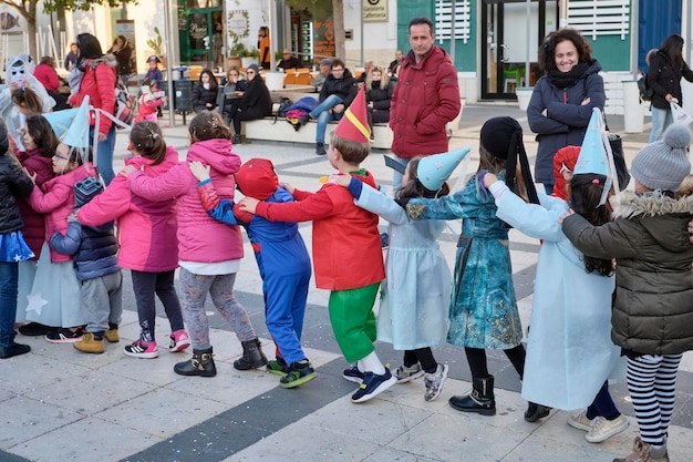 Italy, Sicily, Marina di Ragusa (Ragusa Province); 2 March 2019, kids playing for Carnival in a central square of the town - EDITORIAL