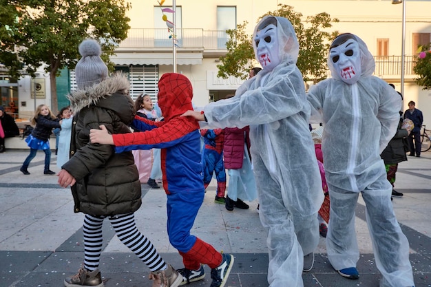 Italy, Sicily, Marina di Ragusa (Ragusa Province); 2 March 2019, kids playing for Carnival in a central square of the town - EDITORIAL