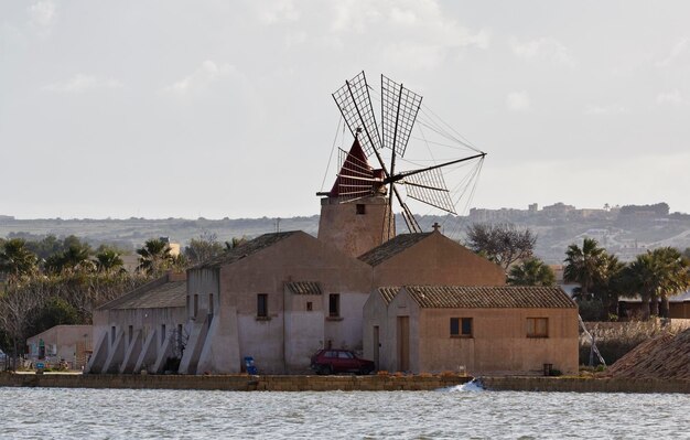 Italy, Sicily, Marsala (Trapani), Mozia salt flats and windmill