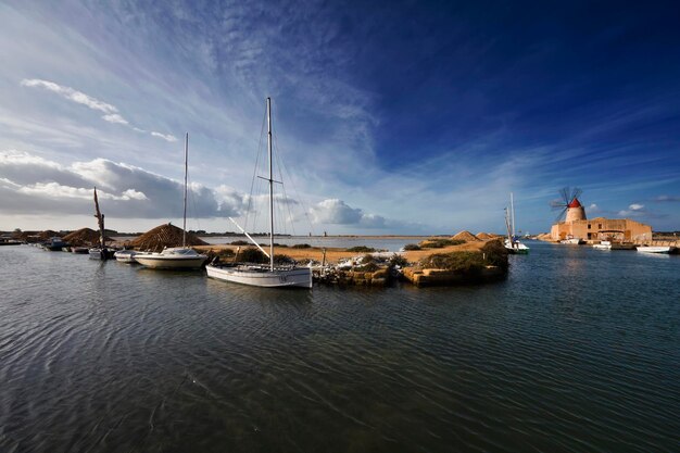 Italy, Sicily, Marsala (Trapani), Mozia salt flats and windmills