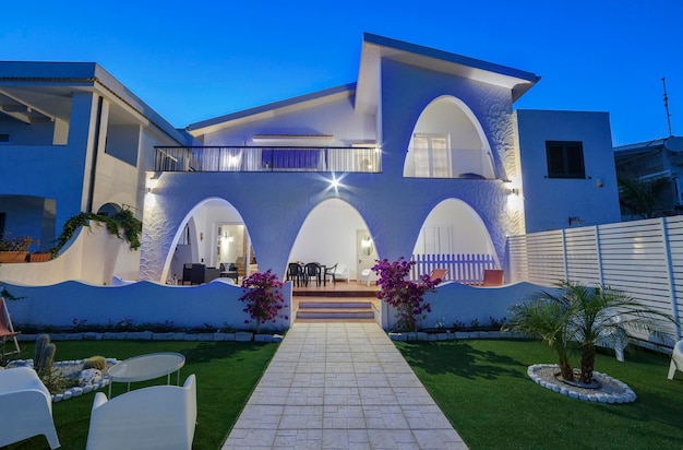 Italy, sicily, mediterranean sea, kaukana beach (ragusa province); 5 june 2018, elegant private house on the beach, view of the patio at sunset - editorial