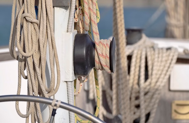 Italy, Sicily, Mediterranean Sea, Marina di Ragusa (Ragusa Province); winch and nautical ropes on a sailing boat in the port