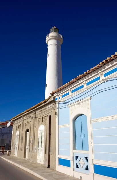 Italy, Sicily, Mediterranean sea, Punta Secca (Ragusa Province), old stone houses on the sea front and the lighthouse