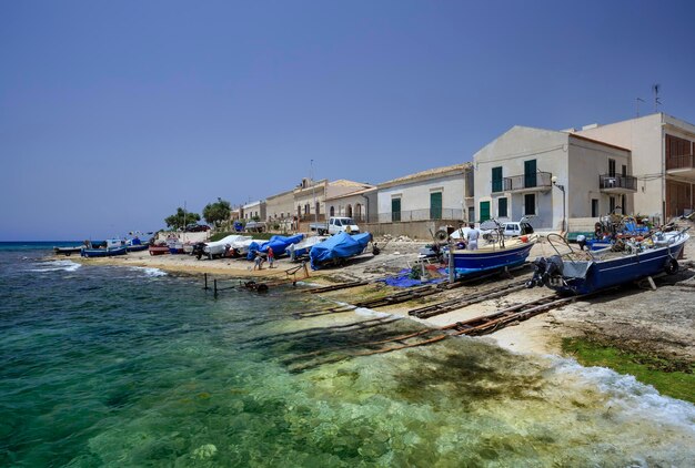 Italy, Sicily, Mediterranean sea, Sampieri (Ragusa Province), fishermen working ashore