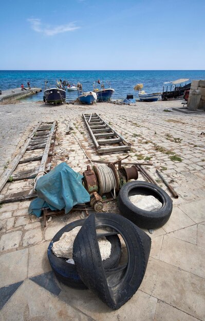 Italy, sicily, mediterranean sea, sampieri (ragusa province), fishing boats ashore