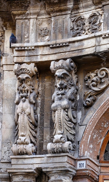 Italy, Sicily, Noto (Siracusa Province), baroque building facade, ornamental statues