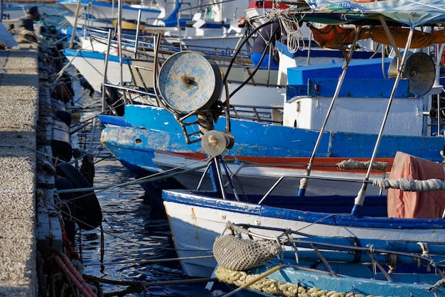 Italy, Sicily, Portopalo di Capo Passero, wooden fishing boats in the port