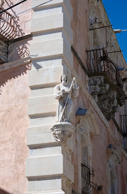 Italy, Sicily, Ragusa Ibla, baroque building facade, religious statue
