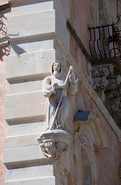 Italy, Sicily, Ragusa Ibla, baroque building facade, religious statue