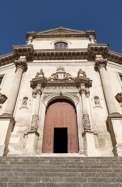 Italy, sicily, ragusa ibla, purgatory saint souls baroque church (chiesa delle anime sante del purgatorio), 1757 a.c., statues and decorations on the baroque facade of the church