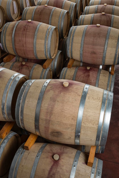 Italy Sicily Ragusa Province wooden wine barrels in a wine cellar