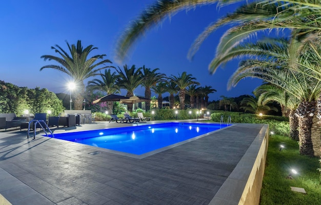 Italy, sicily, sampieri (ragusa province), countryside, stone house swimming pool in the garden at sunset