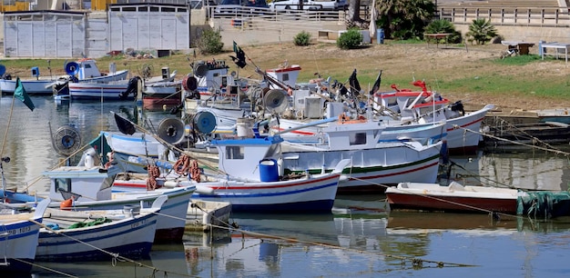 Italy, Sicily, Scoglitti (Ragusa Province), 18 June 2020, sicilian wooden fishing boats and in the port - EDITORIAL