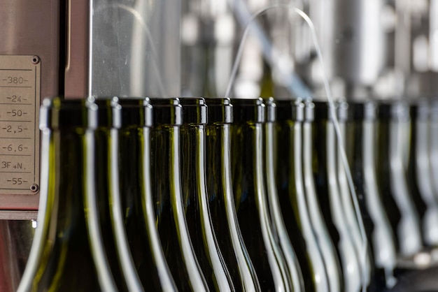 Photo italy sicily wine bottles ready to be washed and filled with wine by an industrial machine in a wine factory